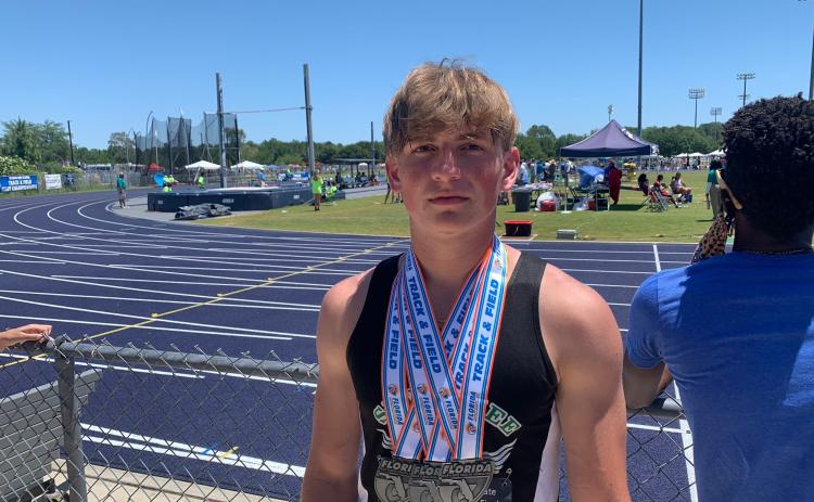 Suwannee track & field athlete Garrison Beach is pictured with his three medals from the Class 2A state meet on Saturday after placing fifth in the javelin, sixth in the 300 hurdles and eighth in the 110 hurdles. (COURTESY)
