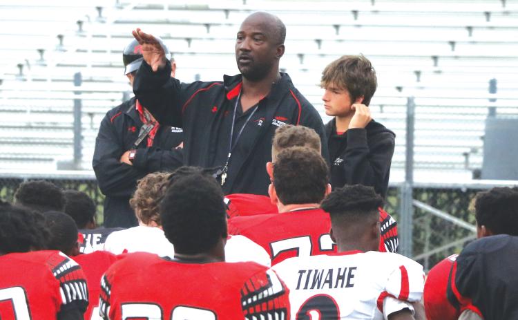 Fort White coach Demetric Jackson talks to his team following the Red & Black game on Thursday. (MORGAN MCMULLEN/Lake City Reporter)