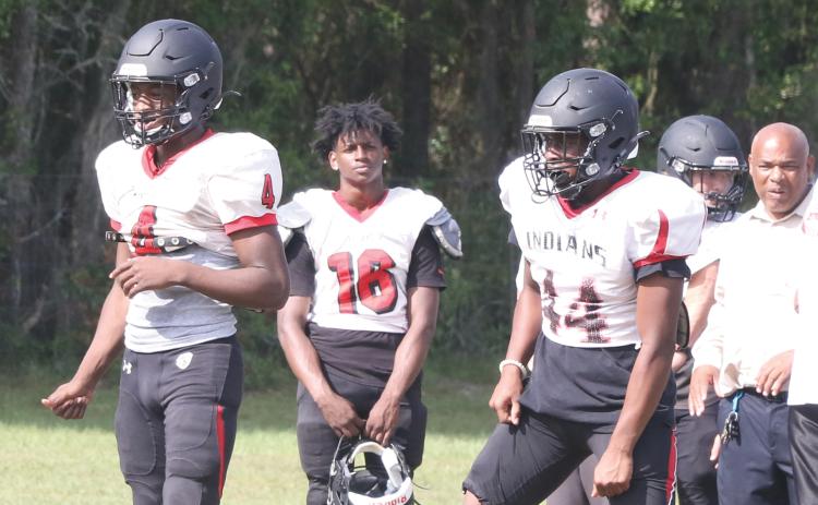Fort White quarterback Darren Clark (left) and running back Jaylen Brown (right) line up in the shotgun during Tuesday’s practice. (MORGAN MCMULLEN/Lake City Reporter)