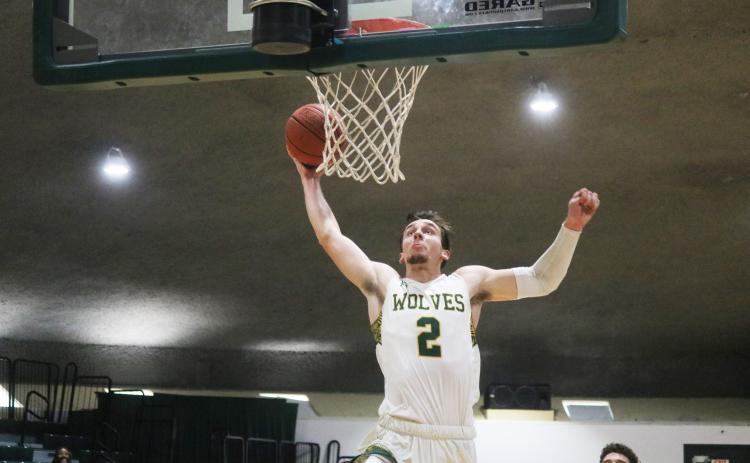 FGC forward Layton Veon rises on a fast break for a dunk against Pasco-Hernando State during the Region 8 championship game on March 27. Veon committed to Coastal Georgia on Thursday after finishing up his two years with the Timberwolves. (JORDAN KROEGER/Lake City Reporter)