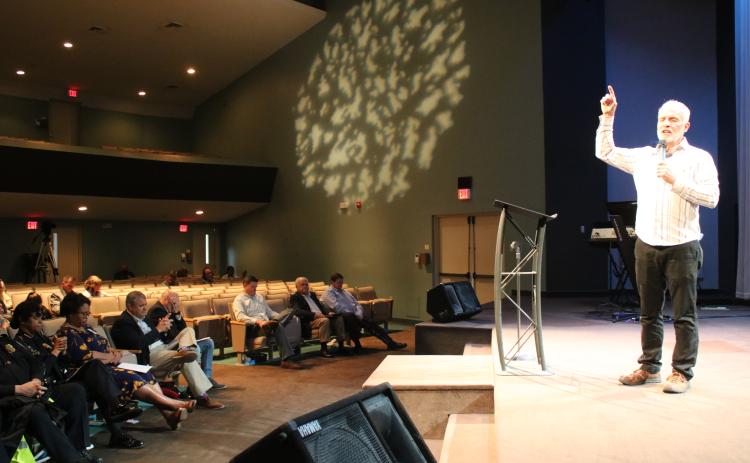 Matt Glover, New Life Christian Fellowship pastor, says a prayer for the nation Thursday afternoon during a National Day of Prayer service in New Life Christian Fellowship sanctuary. (TONY BRITT/Lake City Reporter)