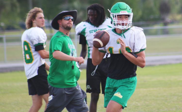Suwannee quarterback Kodi Lang sets to pass during practice on April 29. (JAMIE WACHTER/Lake City Reporter)