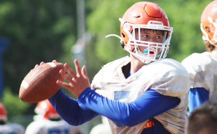 Branford quarterback Kyson Johnson sets to throw during Tuesday’s practice. (JAMIE WACHTER/Lake City Reporter)