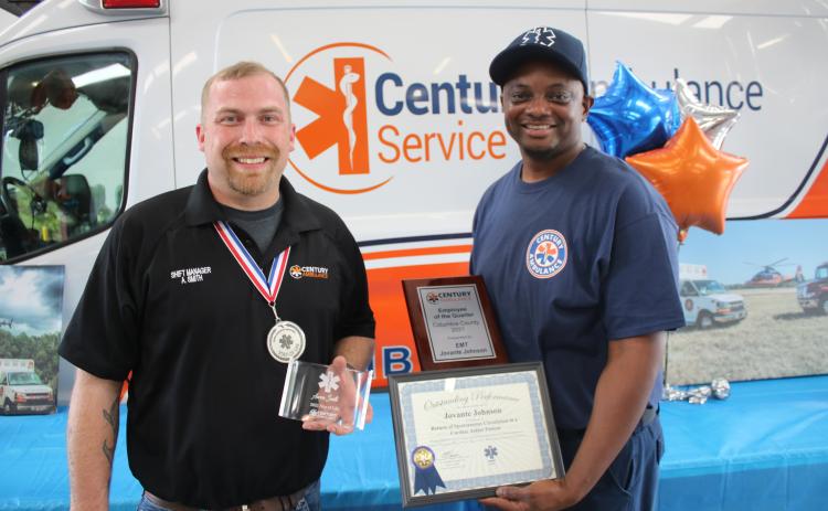 Aaron Smith (left), a Century Ambulance shift manager, was recognized as the agency’s Star of Life Award recipient which recognizes the team member whose contributions as an ambulance professional has gone above the call of duty in service to their communities. Smith stands with Jovante Johnson who was honored as the EMT employee of the quarter. Amanda Slater, who was awarded the paramedic employee of the quarter, was unavailable for the photograph. (TONY BRITT/Lake City Reporter)