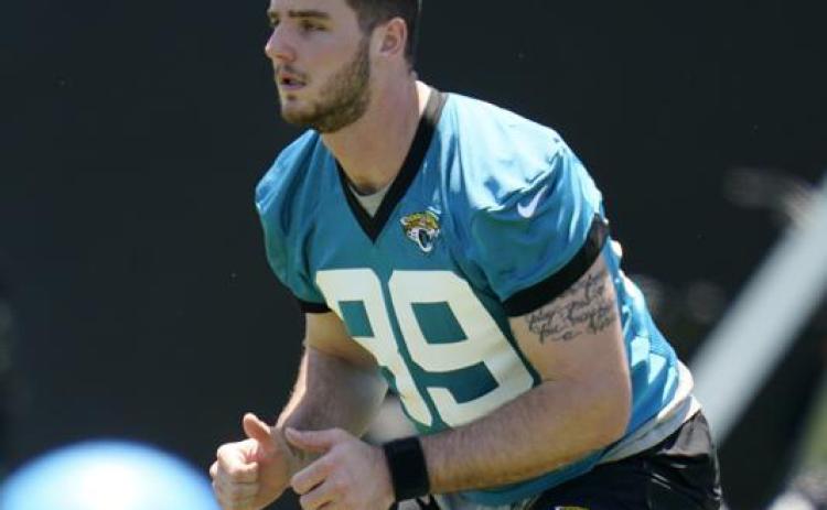 Jacksonville Jaguars tight end Luke Farrell performs a drill during rookie minicamp on Saturday in Jacksonville. (JOHN RAOUX/Associated Press)