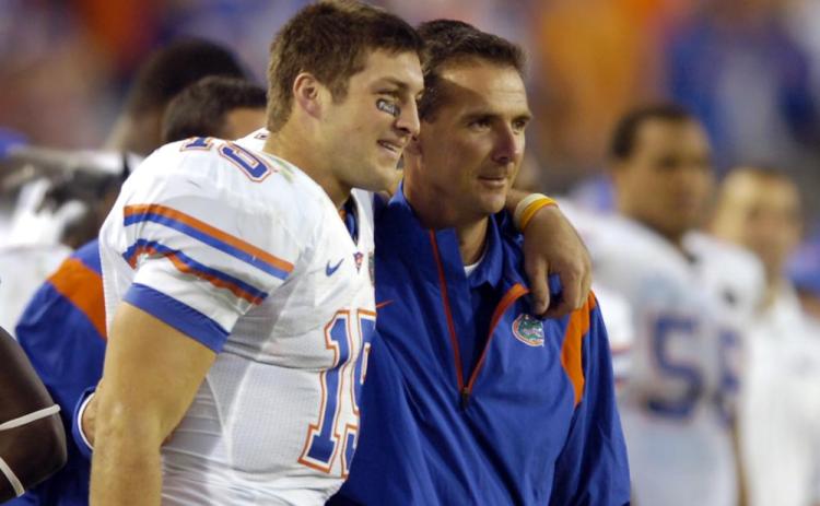 Former Florida quarterback Tim Tebow, left, and former Florida coach Urban Meyer celebrate in the fourth quarter during a college football game against Georgia on Nov. 1, 2008, in Jacksonville. Tebow and Meyer are together again, this time in the NFL and with Tebow playing a new position. The former Florida star and 2007 Heisman Trophy-winning quarterback signed a one-year contract with the Jacksonville Jaguars on Thursday and will attempt to revive his pro career as a tight end. (AP FILE PHOTO)