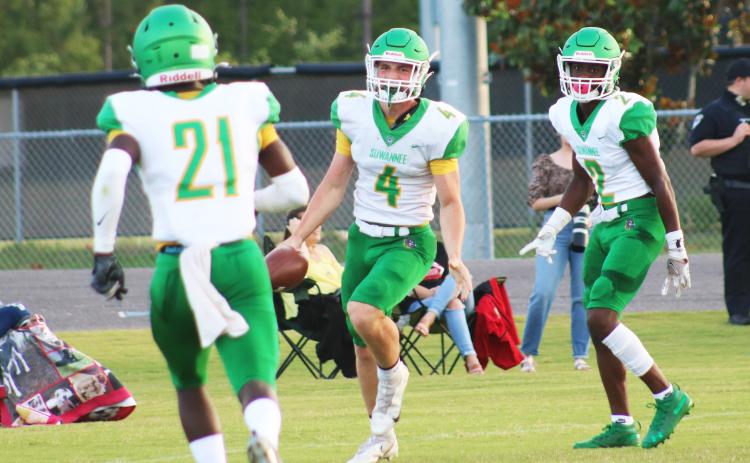 Suwannee receiver Garrison Beach (4) celebrates with teammates after catching a touchdown pass against Oakleaf in the teams’ spring game on May 21. (JAMIE WACHTER/Lake City Reporter)