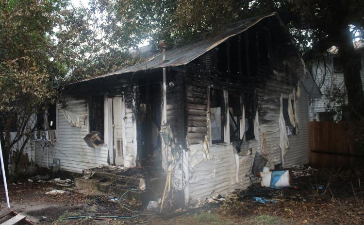 The remains of the house at 441 Northwest Madison Street after a fire destroyed much of the property in and surrounding the home. (COURTESY)