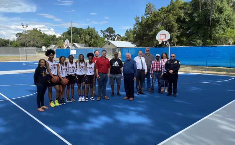 A grand opening for the new basketball courts at Youngs Park was held Thursday night with members of the Columbia High School girls basketball team, representatives of Target and City of Lake City officials. (COURTESY)