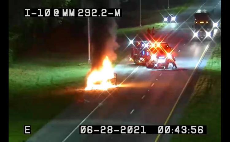 Suwannee County Fire Rescue crews respond to a burning van on Interstate 10 west just after midnight Monday morning. (COURTESY)