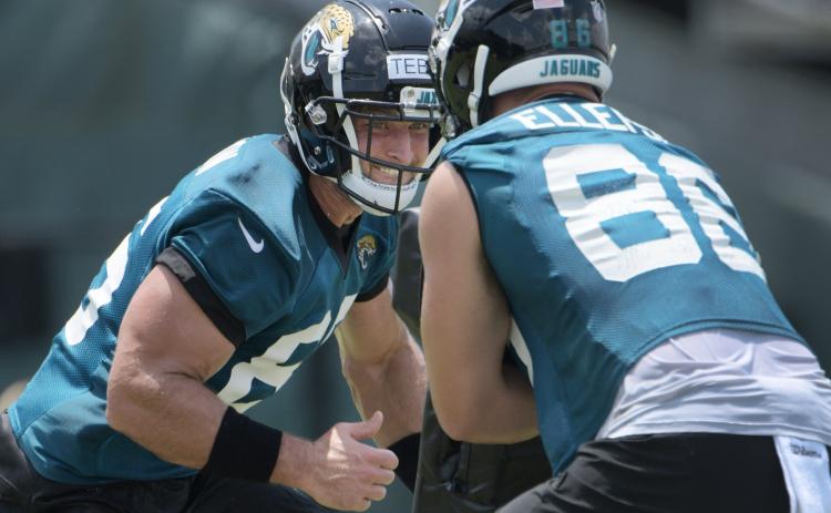 Jacksonville Jaguars tight end Tim Tebow (85) prepares to make contact with Ben Ellefson (86) during an OTA session on May 27. (BOB SELF/Florida Times-Union/TNS)