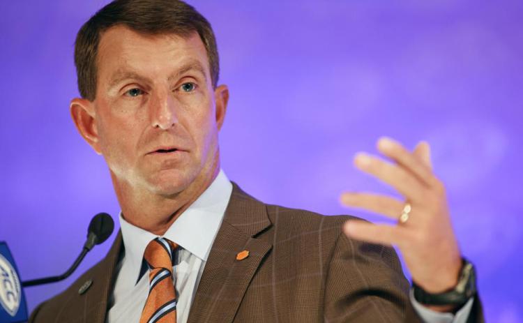 Clemson head coach Dabo Swinney answers a question during ACC Kickoff media days on Thursday in Charlotte, N.C. (NELL REDMOND/Associated Press)