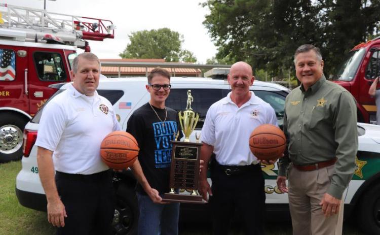 Lt. Dwight Boozer (from left) of the Lake City Fire Department, stands with Lake City Middle School Principal Robert Cooper, Columbia County Fire Rescue Chief Jeff Crawford and Columbia County Sheriff Mark Hunter. (COURTESY)
