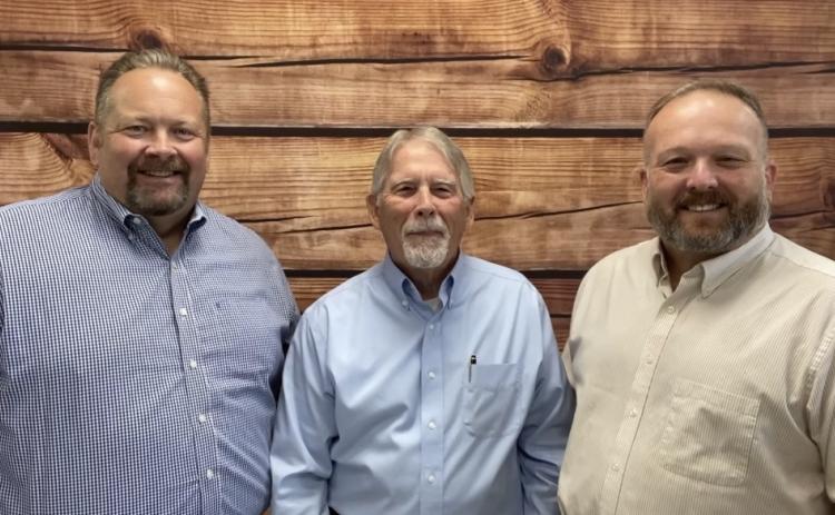 Lake City Reporter Publisher Todd Wilson (left) meets with GulfCoast Financial Services Founder and CEO John Kuykendall and President Brent Kuykendall to discuss a First Responders Appreciation Lunch set for Friday. (COURTESY)