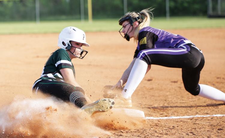 Suwannee’s Karis Smith (left) slides in underneath a tag last season against Columbia. Smith ended her junior season as the team’s ace in the cirlce, finishing 8-4 with a 2.88 ERA. (BRENT KUYKENDALL/Lake City Reporter)