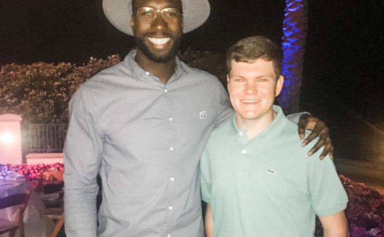 Eli Stewart (right) poses with former Gators basketball star Patric Young during the Tom Coughlin Jay Fund Celebrity Golf Classic in May. (COURTESY)