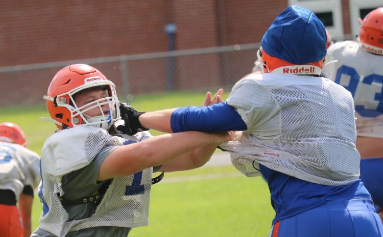 Branford offensive lineman John Coker blocks during practice on Friday. (JAMIE WACHTER/Lake City Reporter)