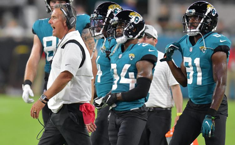 Jacksonville Jaguars head coach Urban Meyer tries to get his players attention late in the third quarter of play of Saturday’s preseason game against the Cleveland Browns at TIAA Bank Field in Jacksonville. (TRIBUNE NEWS SERVICE)