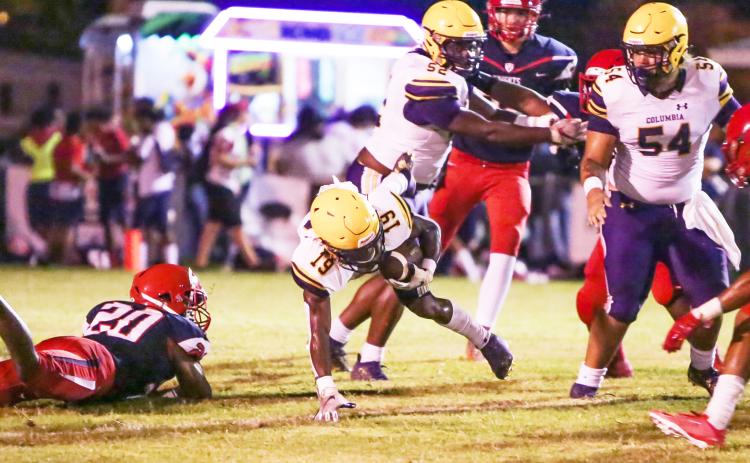 Columbia running back Leo Robinson stumbles to the ground on a carry during Friday's Preseason Classic against Vanguard. (BRENT KUYKENDALL/Lake City Reporter)