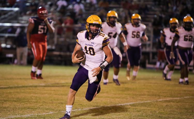 Columbia quarterback Kade Jackson finds running room Friday at Vanguard. (BRENT KUYKENDALL/Lake City Reporter)