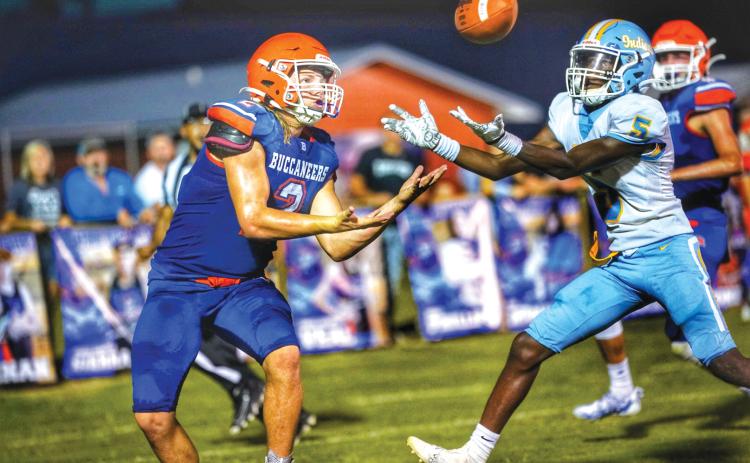 Branford slot receiver Caden Coker (left) battles a Chiefland defender for a pass Friday night. (BRIAN LEWIS/Special to the Reporter)