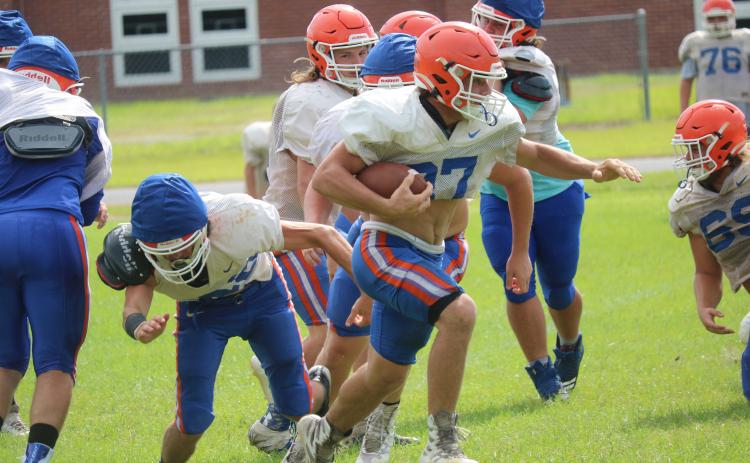 Branford running back Bodhi White turns up the field during practice on Aug. 13. (JAMIE WACHTER/Lake City Reporter)