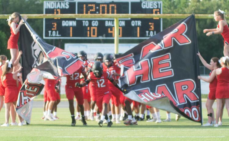 Fort White receiver Najeeb Smith leads his team on the field prior to last week's Preseason Classic against Middleburg. (CHRISTINA FEAGIN/Special to the Reporter)