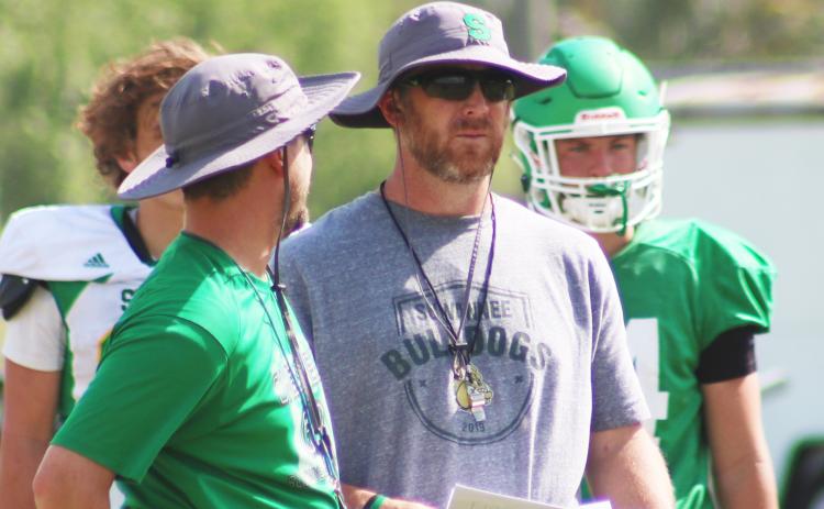Suwannee coach Kyler Hall (right) looks on during spring practice in April. (JAMIE WACHTER/Lake City Reporter)