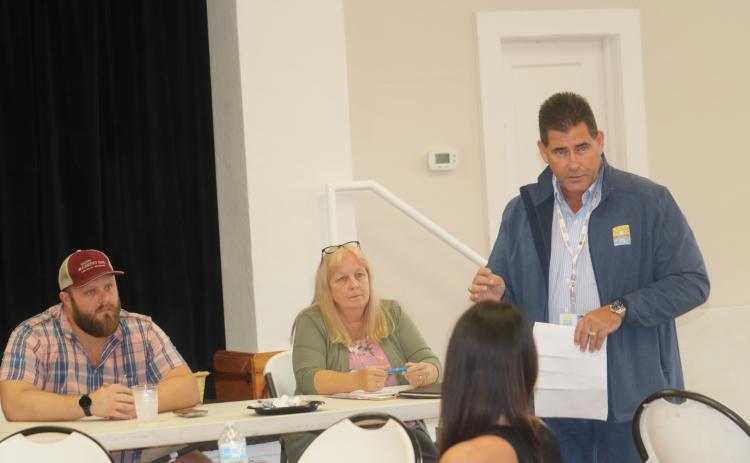 Columbia County Health Department Administrator Tom Moffses (right) speaks to the Kiwanis Club of Lake City on Tuesday. (TONY BRITT/Lake City Reporter)