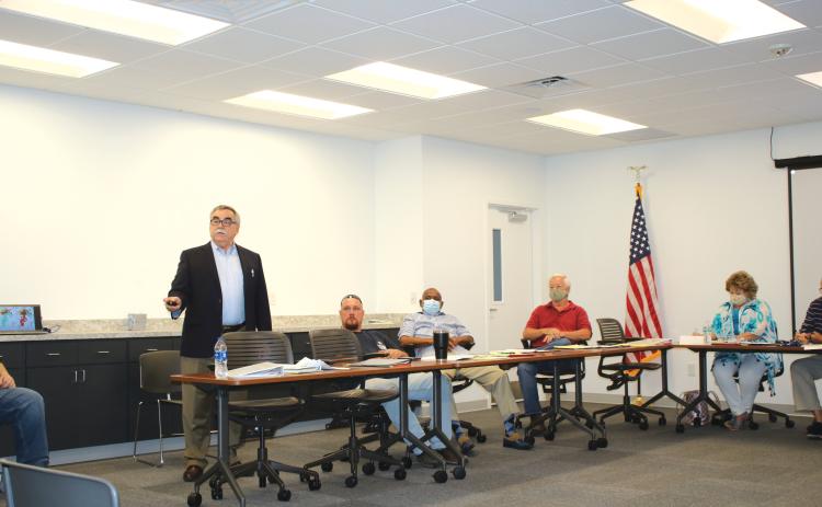 Kurt Spitzer (left) gives a presentation about building redistricting maps Wednesday afternoon. (TONY BRITT/Lake City Reporter)