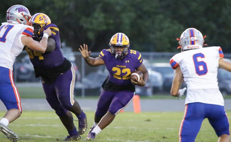 Columbia running back Tony Fulton looks for running room against Bolles on Friday night. (BRENT KUYKENDALL/Lake City Reporter)