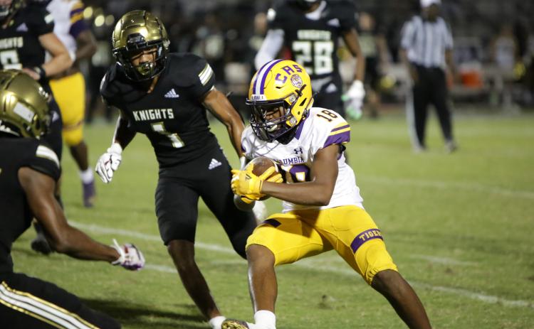 Columbia receiver Keeven Young runs up the field after a catch against Oakleaf on Sept. 10. (BRENT KUYKENDALL/Lake City Reporter)