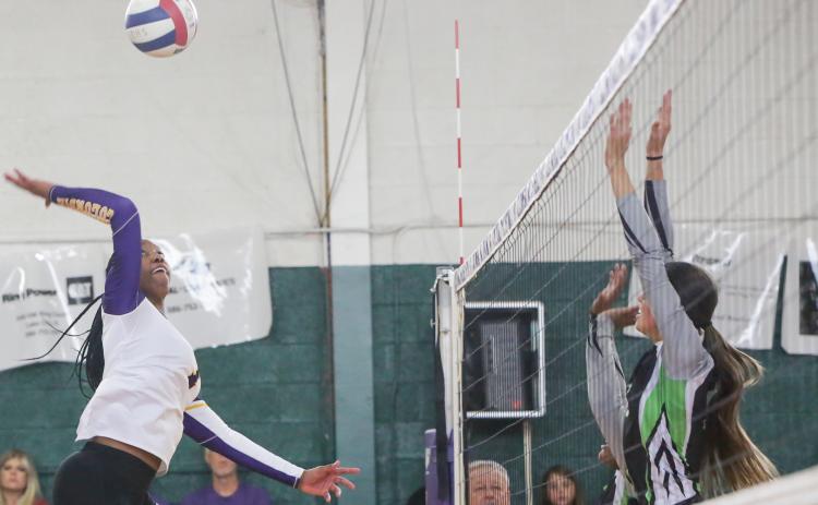 Columbia’s Brandi Oliver sends a shot over the net against Suwannee on Tuesday night. (BRENT KUYKENDALL/Lake City Reporter)
