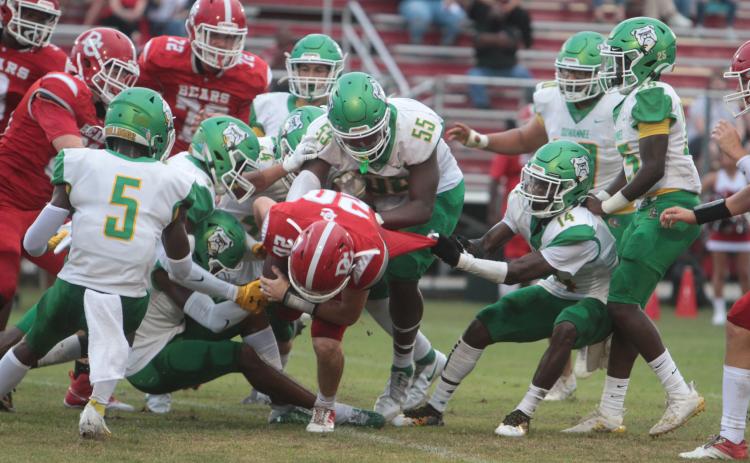 Suwannee safety Trevion Milton tackles Dixie County running back Bryar Mitchell on Aug. 27. (PAUL BUCHANAN/Special to the Reporter)
