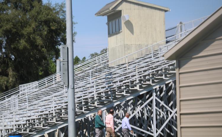 Lake City Growth Management Director David Young (left) tours the facility at Memorial Stadium Monday afternoon. (TONY BRITT/Lake City Reporter)