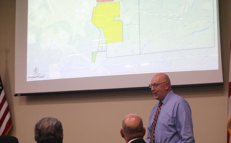 Florida Gateway College President Lawrence Barrett discusses concerns the college has with Lake City and Columbia County officials in a joint meeting Tuesday. (TONY BRITT/Lake City Reporter)
