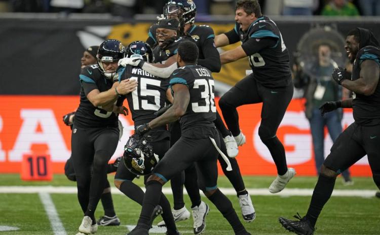 Jacksonville Jaguars kicker Matthew Wright  (center) celebrates after kicking a game-winning field goal to defeat the Miami Dolphins at the Tottenham Hotspur stadium in Oct. 17 in London, England. (MATT DUNHAM/Associated Press)
