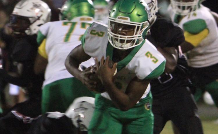 Suwannee running back Malachi Graham runs past a Madison County tackler on Oct. 8. (PAUL BUCHANAN/Special to the Reporter)