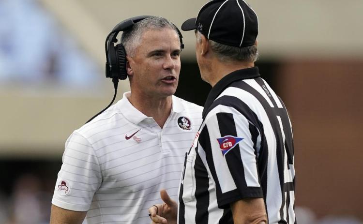 Florida State head coach Mike Norvell speaks with an official during a game against North Carolina on Oct. 9 in Chapel Hill, N.C. (GERRY BROOME/Associated Press)