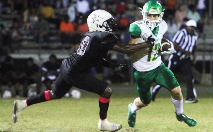 Suwannee receiver Camdon Frier runs up the field after a catch against Madison County on Friday. (PAUL BUCHANAN/Special to the Reporter)