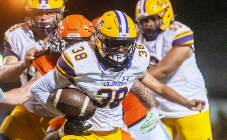 Columbia running back Malik Moore rushes up the field against Orange Park on Friday. (FRAN RUCHALSKI/Special to the Reporter)