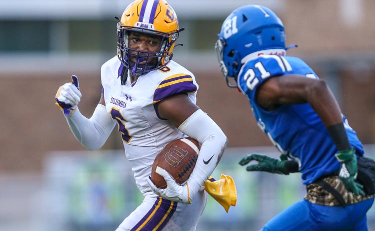 Columbia receiver Tray Tolliver runs up the field pursued by Riverside cornerback Joe Morrison during last Friday's game. (GARY LLOYD MCCULLOUGH/Special to the Reporter)