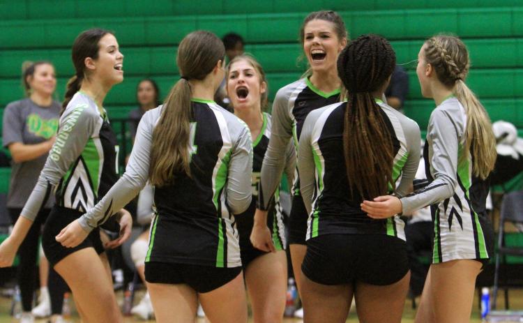 Suwannee celebrates a point against Columbia on Wednesday. (PAUL BUCHANAN/Special to the Reporter)