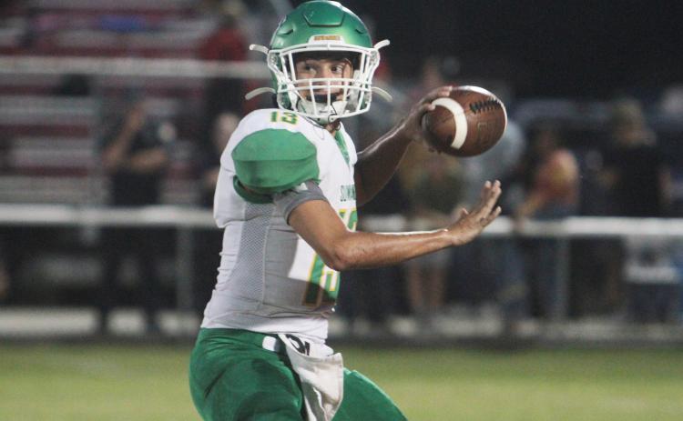 Suwannee quarterback Bronsen Tillotson gets set to throw a pass against Dixie County on Aug. 27. (PAUL BUCHANAN/Special to the Reporter)