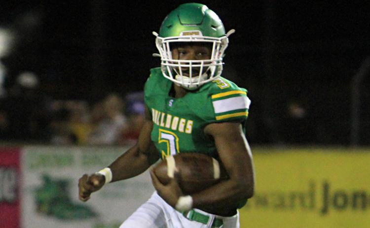Suwannee running back Malachi Graham rushes up the field against Paxon on Oct. 15. (PAUL BUCHANAN/Special to the Reporter)