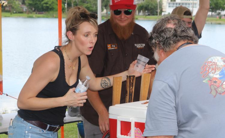 Holly Frazier discusses the options available at Halpatter Brewing Co.’s tent at the 2019 Gateway City Craft Beer and Wine Festival. (FILE)