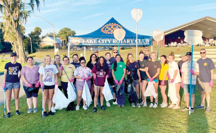 Columbia High School students preparing to pull trash from Lake DeSoto last Saturday as part of the Rotary Club of Lake City - Downtown’s Lake DeSoto Lake Clean-Up event. (COURTESY)