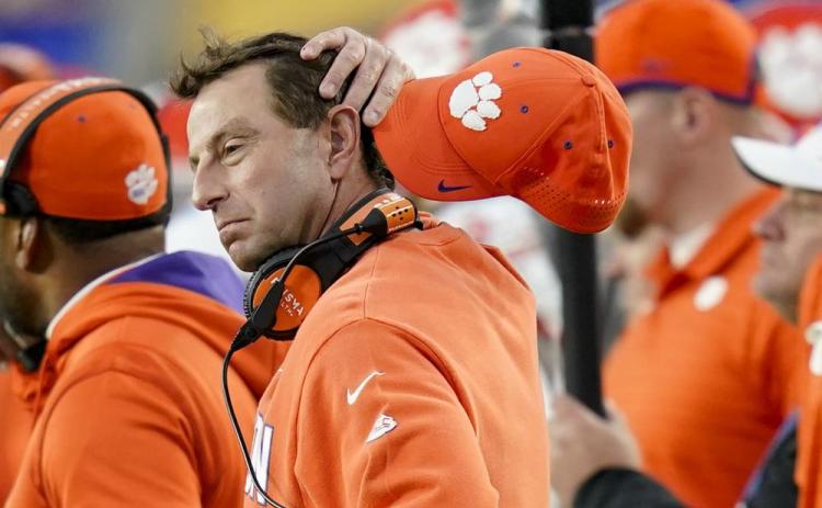 Clemson head coach Dabo Swinney wipes his head as he watches as his team play against Pittsburgh on Oct. 23 in Pittsburgh. Pittsburgh won 27-17. (KEITH SRAKOCIC/Associated Press)