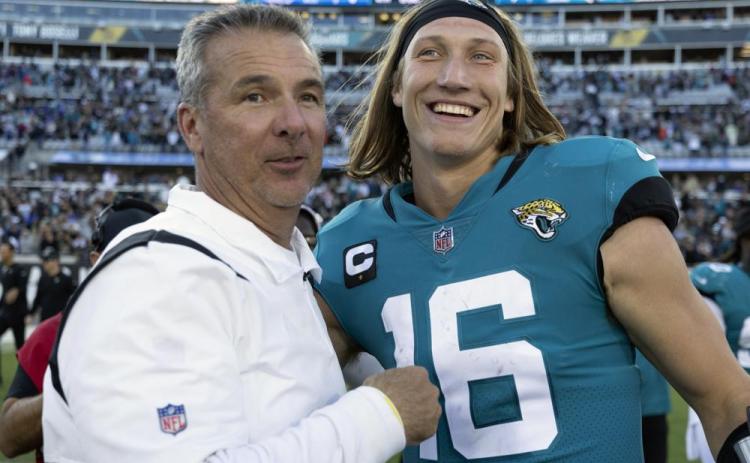 Jacksonville Jaguars head coach Urban Meyer, left, and quarterback Trevor Lawrence celebrate after defeating the Buffalo Bills on Sunday in Jacksonville. (AP Photo/STEPHEN B. MORTON/Associated Press)