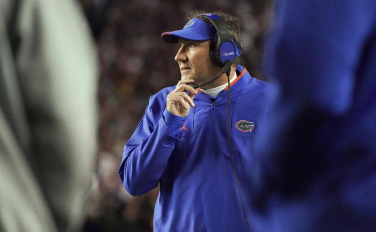 Florida head coach Dan Mullen watches from the sideline during the a game against South Carolina on Nov. 6 in Columbia, S.C. (SEAN RAYFORD/Associated Press)